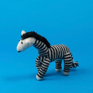 Luxury dog toys for the modern home from Hogan Parker. Hand knit zebra dog toy. 