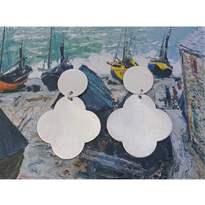 Style is Gloria Little. Color is Silver. Handmade jewelry brass statement earrings. Hogan Parker is a contemporary luxury online shop for books, gifts, vintage wares, soap, jewelry, home decor, cookware, kitchenware, and more.