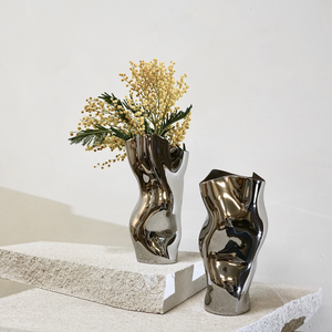 Shop home decor. Elegant stainless steel vase.  Hogan Parker is a contemporary luxury online shop for books, gifts, vintage wares, soap, jewelry, home decor, cookware, kitchenware, and more.