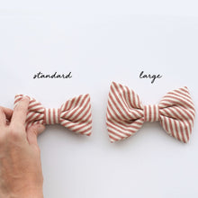 Load image into Gallery viewer, Dog bow tie sizing comparison. 
