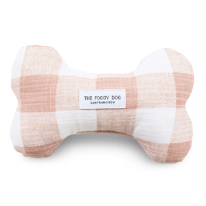 Luxury dog toys for the modern home from Hogan Parker. Eco-friendly dog bone dog toy in gingham blush. The Foggy Dog.